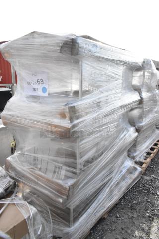 Three Regency 109APR1820L bun pan racks, new, scratch and dent, wrapped in plastic, non-marking casters, unassembled.