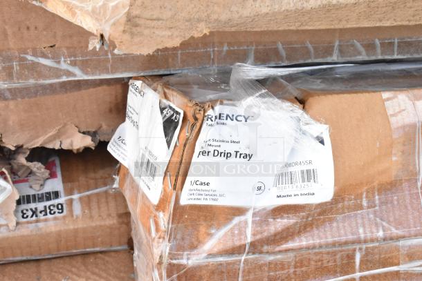 Stacked boxes labeled "Regency 45" x 5" Stainless Steel Surface Mount Beer Drip Tray," showing signs of wear in packaging.