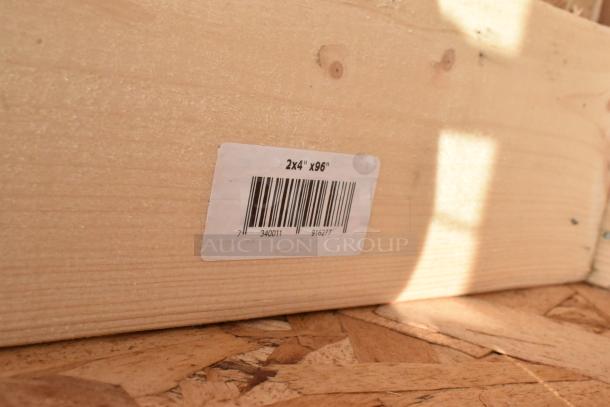 Crate labeled 2x4"x96" containing brand new scratch and dent sneeze guards. Bar code visible.
