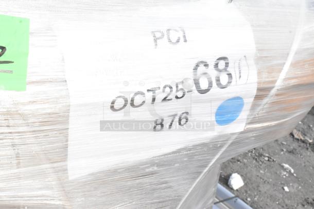Three brand new metal pan racks with visible shipping labels, showing minor scratches and dents, packaged for auction.