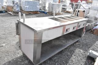 Seco stainless steel 4-bay steam table with under shelf, 208 volts, commercial-grade, outdoor setting, lightly used condition.