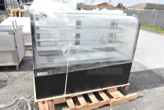 Brand new Avantco 193BC60HCB 60" curved glass black refrigerated bakery display case on pallet. Glass shows visible damage.