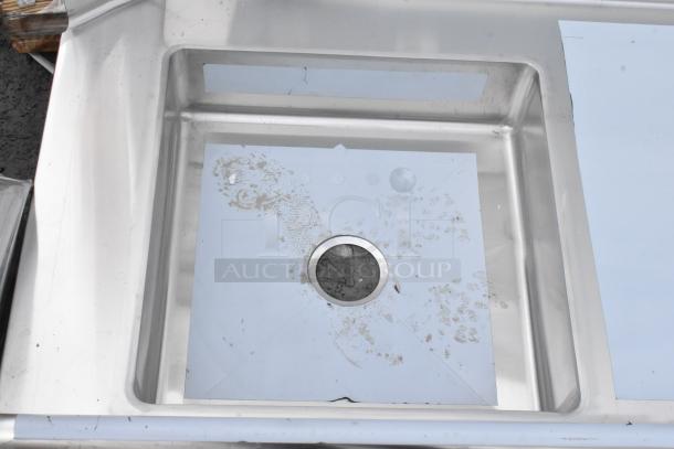 Brand new Regency 600DDT72R soiled dish table, 16-gauge stainless steel, 6' with right drainboard. Visible scratches and dents.