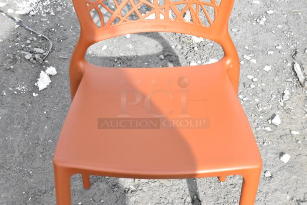 Lancaster Table & Seating Flora Terracotta Resin Chair with webbed back. Scratch and dent condition, new.