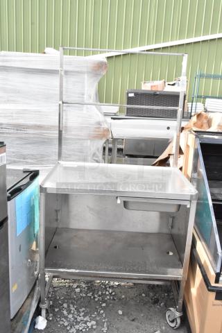 Winholt stainless steel cart by Killion, featuring a drawer, under shelf, and commercial casters. Good condition.
