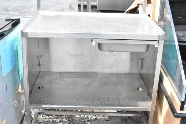 Winholt stainless steel cart with drawer, under shelf, commercial casters; model Killion; used condition.