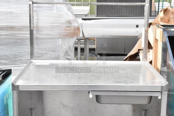Winholt stainless steel cart by Killion, features drawer, under shelf, on commercial casters; excellent condition.