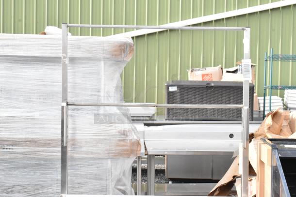 Winholt stainless steel cart by Killion, features a drawer, under shelf, and commercial casters. Wrapped in plastic.