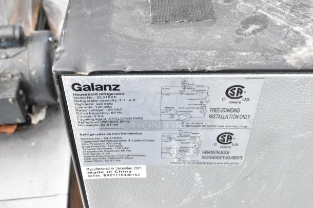Galanz GL31BKE mini cooler, 3.1 cu. ft., 120 VAC, R600A refrigerant, label showing installation info and specs.