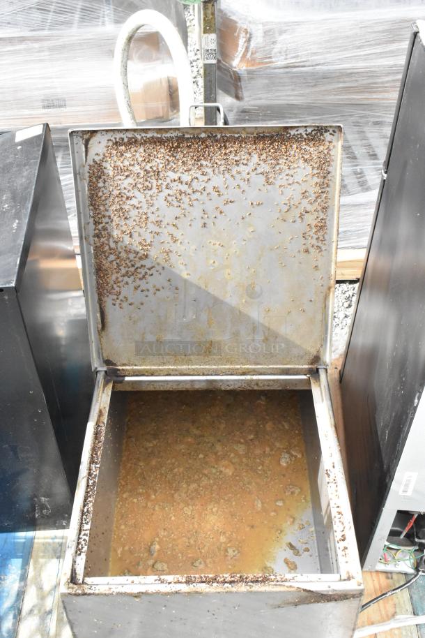 Metal commercial portable fryer oil filter, model 402, 120 volts, 1 phase. Used condition with visible residue inside.