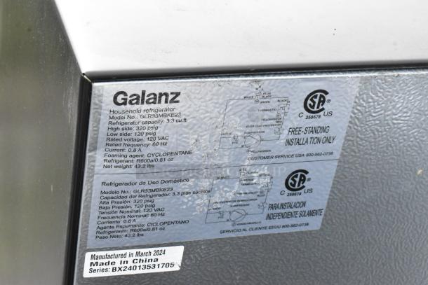 Galanz GLR33MBKE23 label showing model details, 3.3 cu. ft. capacity, 120 VAC, made in China, manufactured March 2024.