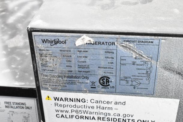 Whirlpool refrigerator label showing model WH31S1E specifications, circuit diagram, and warning notice.