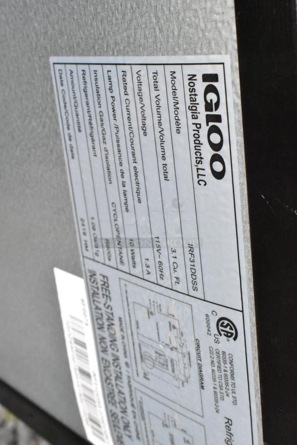Label on Igloo cooler showing model IRF31DDSS, 31 Cu. Ft., 115V, 10 Watts, cyclopentane refrigerant info.