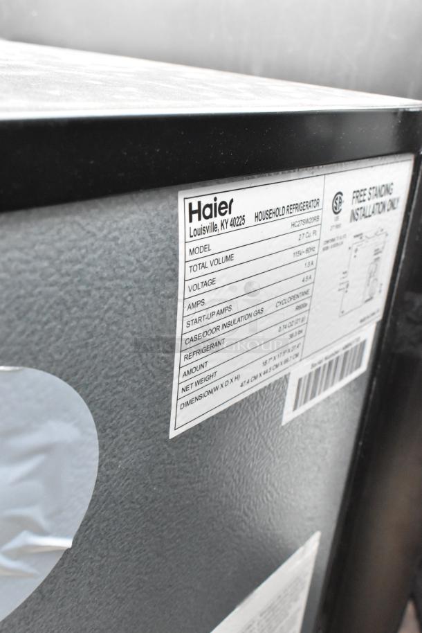 Four mini coolers including Galanz GLR33MBKE23, Galanz GLR25MBKE02, Hisense WFC070M6RWD, and Frigidaire FGFR334. 115 volts. Tags show specifications.