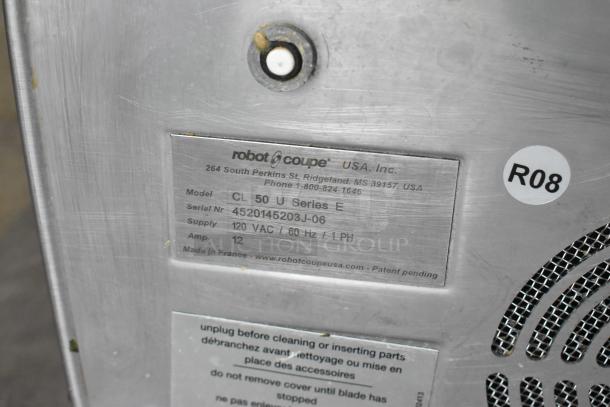 Robot Coupe CL50 Ultra Series E food processor label, showing model, serial number, 120V supply, and made in France.