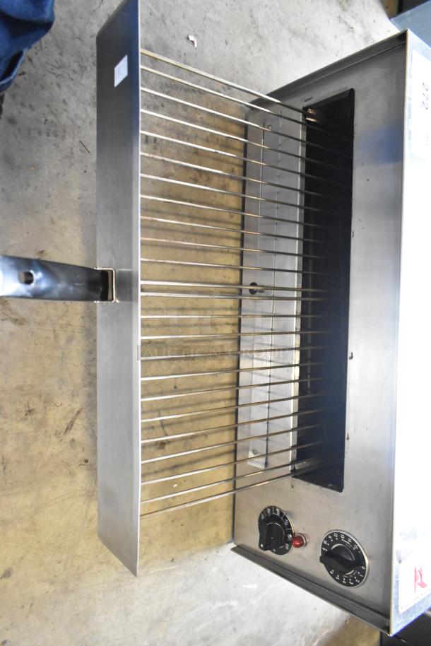 Wisco 560 stainless steel countertop snack oven, commercial use, visible temperature dial, sturdy rack, 120 volts, good condition.