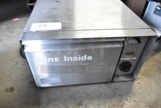 APW Wyott BW-20 warming drawer, metal, for auction. Features: 120 Volts, 1 Phase. Marked "Buns Inside." Used condition.