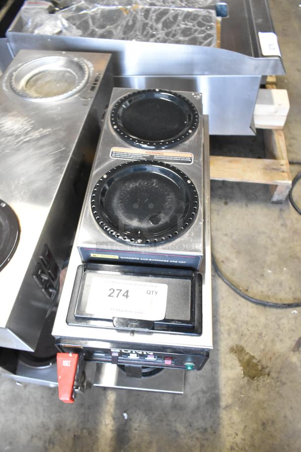 Bunn stainless steel commercial countertop coffee machine with 3 burners, hot water dispenser, 115V, 1 phase. Model includes warning labels and a quantity tag.