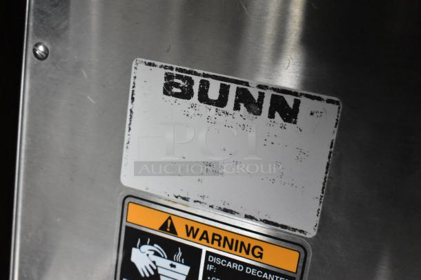Bunn stainless steel coffee machine label, featuring "Bunn" brand at top and a warning sign below. Commercial use.