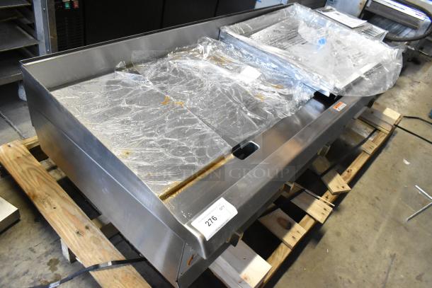 BRAND NEW Cooking Performance Group CPG 351GMCPG60NL 60" stainless steel gas griddle on pallet, scratch and dent condition.