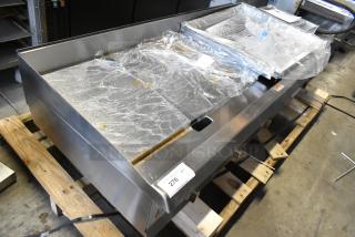 BRAND NEW Cooking Performance Group CPG 351GMCPG60NL 60" stainless steel gas griddle on pallet, scratch and dent condition.