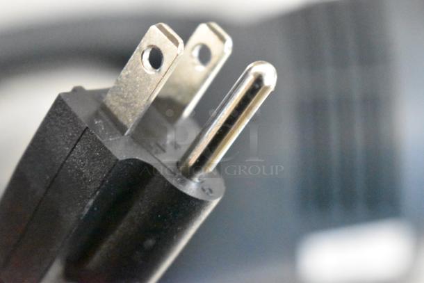 Close-up of a power plug from a brand new AvaMix 928IBHD21 21" heavy-duty variable speed immersion blender, 120 volts.