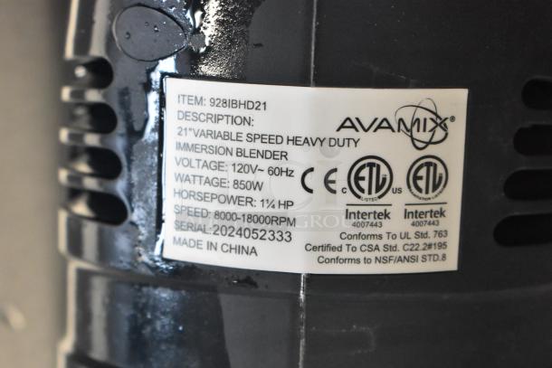 Alt text: "AvaMix 928IBHD21 heavy-duty immersion blender, 21-inch blade, 1 1/4 hp, 120V, 850W, variable speed, tags showing specifications."