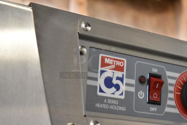 Metro C569-SFC-L C5 Heated Holding Cabinet, control panel with brand logo and power switch visible.