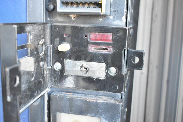 Dixie-Narco DN600E-MC/SII-9 vending machine coin slot and lock, showing slight wear. Credit card acceptor included.