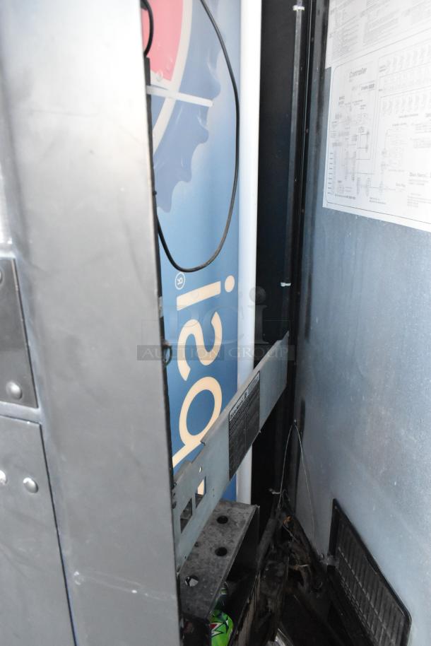 Dixie-Narco DN600E-MC/SII-9 vending machine; partially open with control panel visible. Features card reader, 115V, 1 Phase.