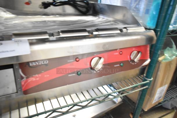 BRAND NEW Avantco 177EG24N Stainless Steel Flat Top Griddle, 208/240V, 1 Phase. Minor scratches. Power and heating controls visible.