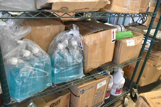 Boxes and bottles of various items, including Betco AF315 disinfectant cleaner. Items are on a metal shelf, in used condition.