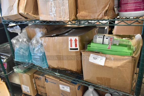 Boxes and bottles of cleaning supplies, including Betco AF315 Disinfectant, on a shelf. Auction lot labeled "157 QTY x7".