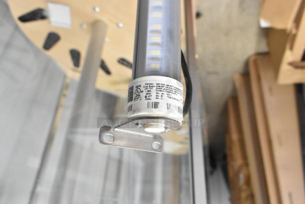 LED light fixture with metal bracket, labeled for indoor/damp use, 40W, 4000K. UL certified. In excellent condition.