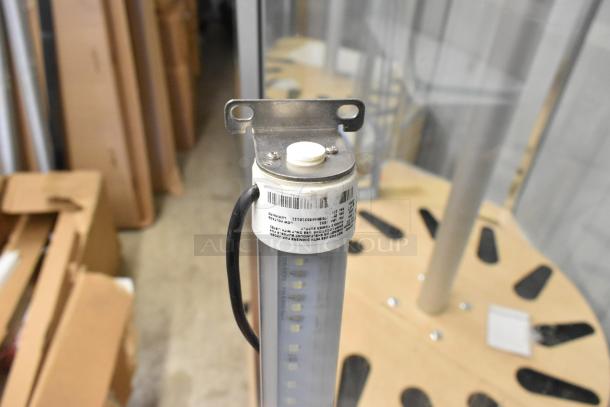 Box of Lights featuring cylindrical LED bulbs with mounting bracket. Barcode and label visible. Condition appears unused.