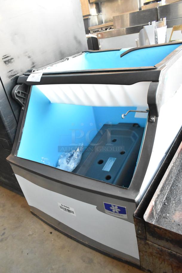 Brand new scratch and dent Manitowoc D400 stainless steel 30" ice bin, 365 lbs capacity, visible model label.