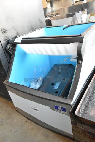Brand new scratch and dent Manitowoc D400 stainless steel 30" ice bin, 365 lbs capacity, visible model label.
