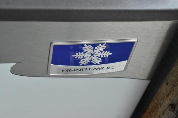 BRAND NEW SCRATCH AND DENT! Manitowoc D400 ice bin, stainless steel, 30", 365 lbs capacity, logo visible on front.