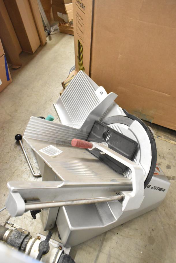 2017 Bizerba metal commercial meat slicer, countertop model, 120V, 1 phase. Good condition, includes safety guard.