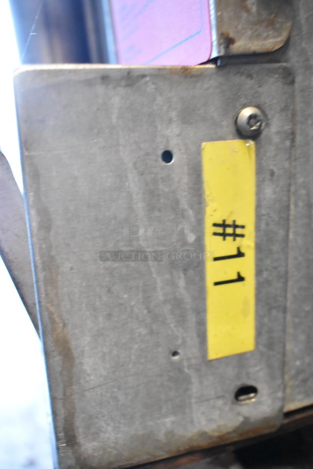 Vulcan stainless steel convection oven with view-through doors, thermostatic controls, and commercial casters. Label: "#11".