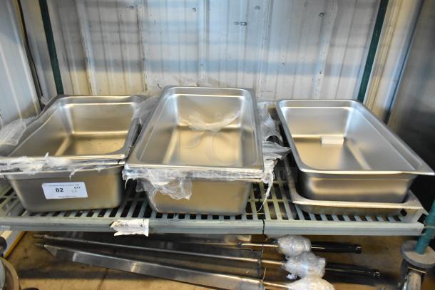 Brand new stainless steel bins and a grease trap, part of 6-piece scratch and dent auction lot.