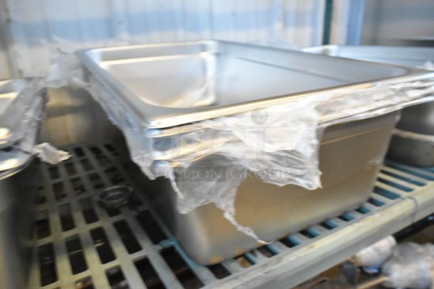 Set of 6 new stainless steel items including grease traps and drop-in bins, minor scratches, wrapped in plastic.