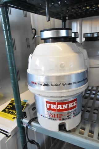 Franke Little Butler Waste Disposer System, model WD-751, 115 volts, 3/4 HP, 1 phase, in good condition, visible on shelf.