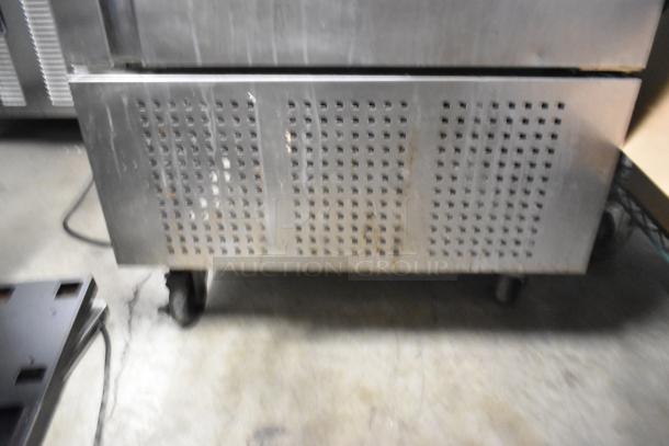 Fagor QVF-1 stainless steel commercial single door reach-in freezer, 115 volts, 1 phase, on casters, visible wear.