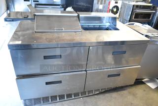 Delfield UCD4464N-12-DD5 stainless steel sandwich prep table with 4 drawers; missing 1 lid, 115V, 1 phase, visible wear.