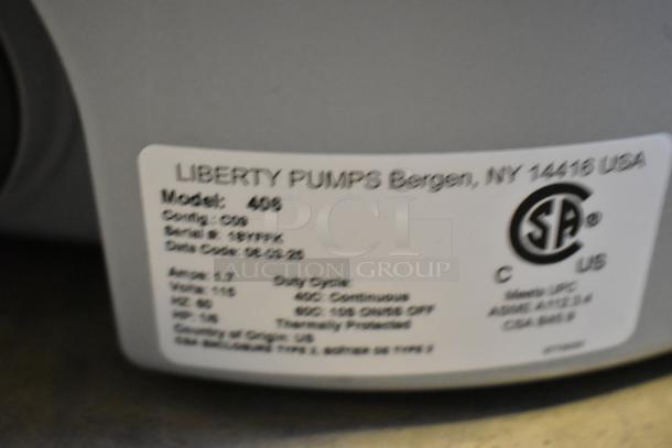 Liberty Pumps 406 model label showing serial number 18199K and electrical specs, CSA certified.