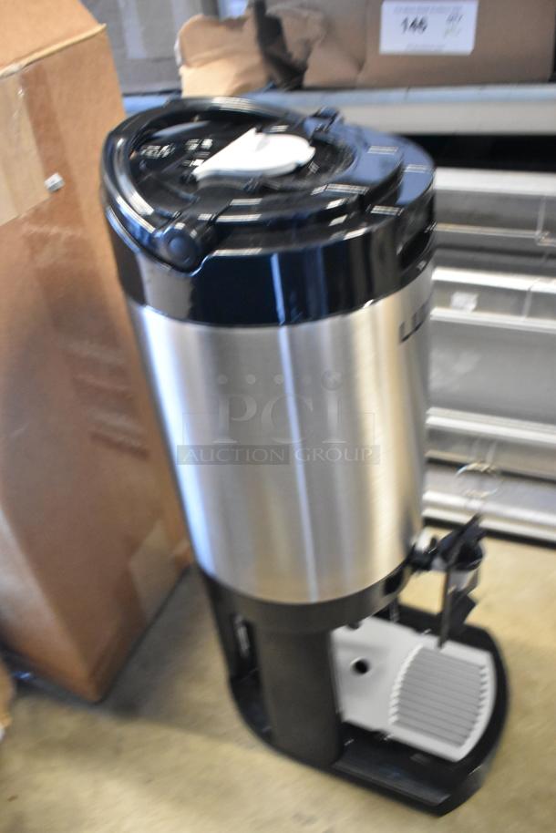 Brand new 2025 Fetco L4D-20TLA 2-gallon stainless steel coffee dispenser with antimicrobial handle and stand. Scratch and dent condition.