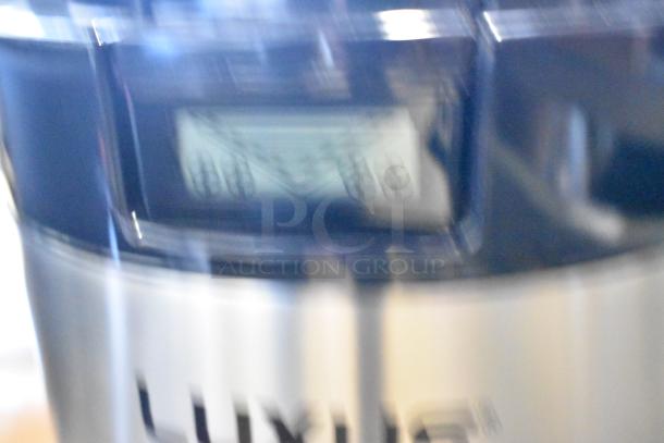 Brand new 2025 Fetco L4D-20TLA Luxus 2-gallon stainless steel coffee dispenser, scratch and dent condition, with antimicrobial handle.