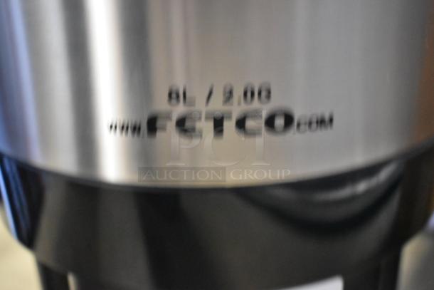 BRAND NEW 2025 Fetco L4D-20TLA 2-Gallon Stainless Steel Coffee Dispenser with Stand; minor scratches; antimicrobial handle.