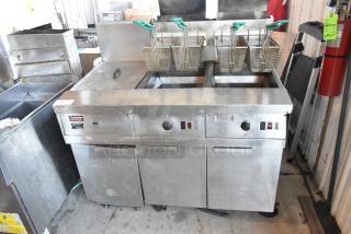 Frymaster FM245ESC stainless steel 2-bay deep fat fryer with dumping station, 4 metal baskets, on casters, 122,000 BTU.